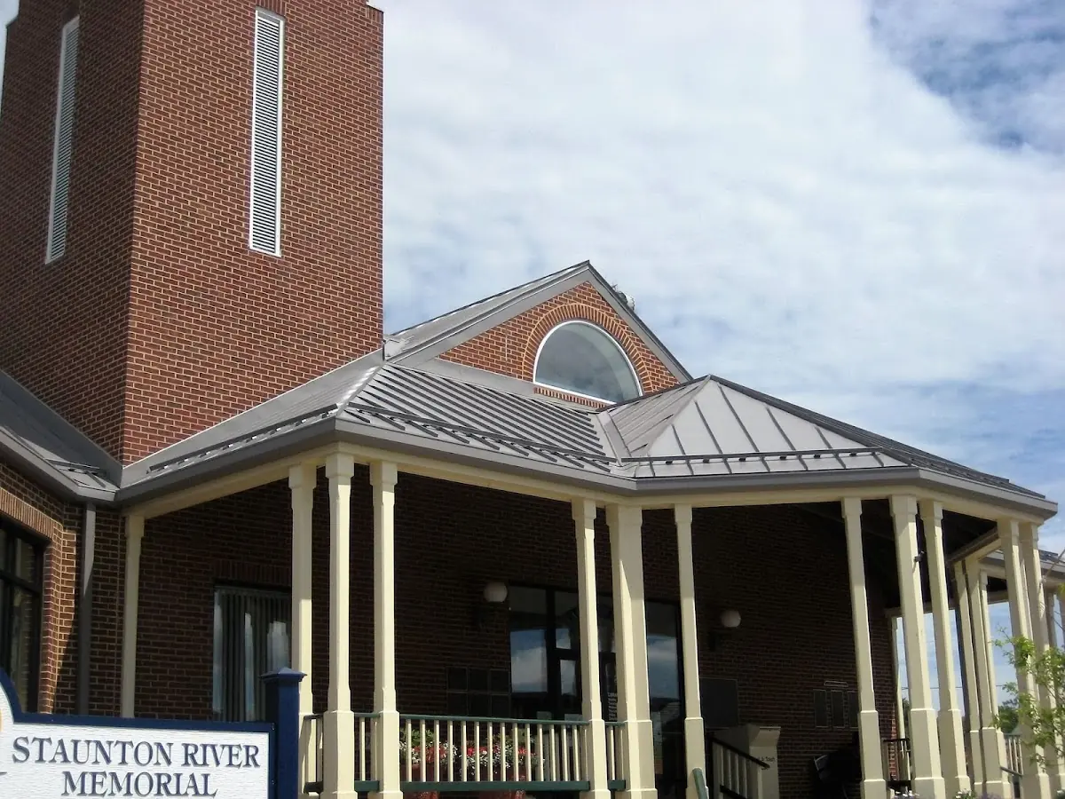 Skilled roofing craftsmen working on a residential roof in Scotia